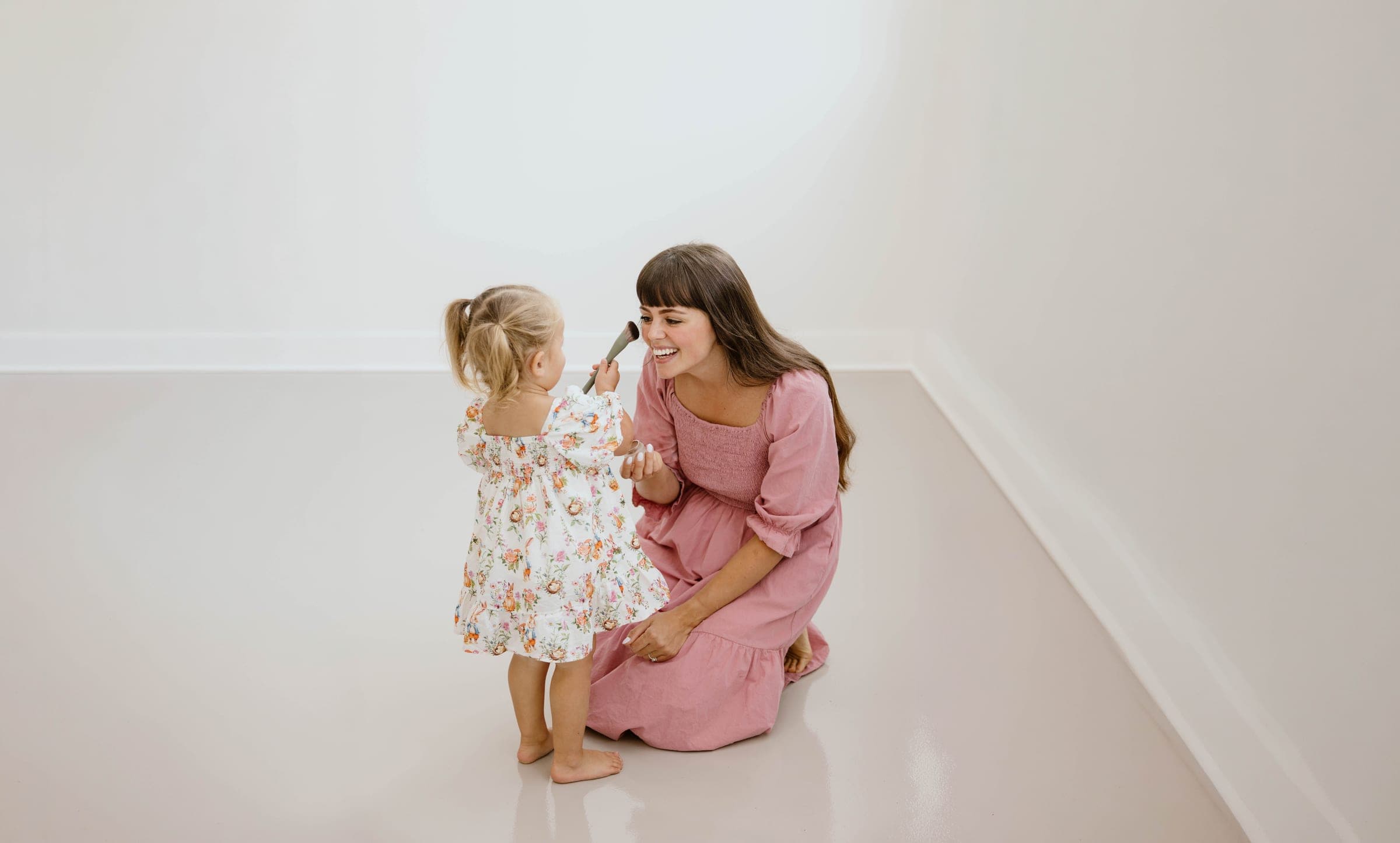 A mother in a cotton dress with her daughter